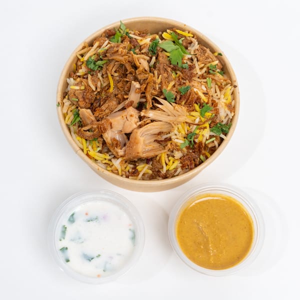 H1B - Hyderabad No1 Biryani's Jackfruit Biryani, with two side sauces, on a white background.