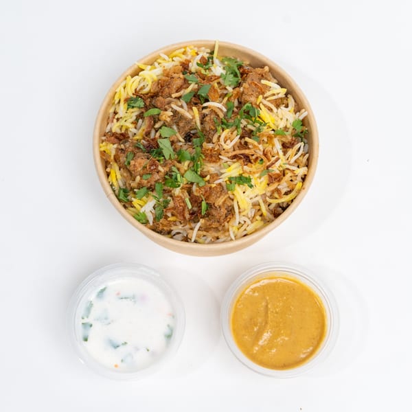 H1B - Hyderabad No1 Biryani: Chicken biryani with rice, fried onions, cilantro, and two sauces.